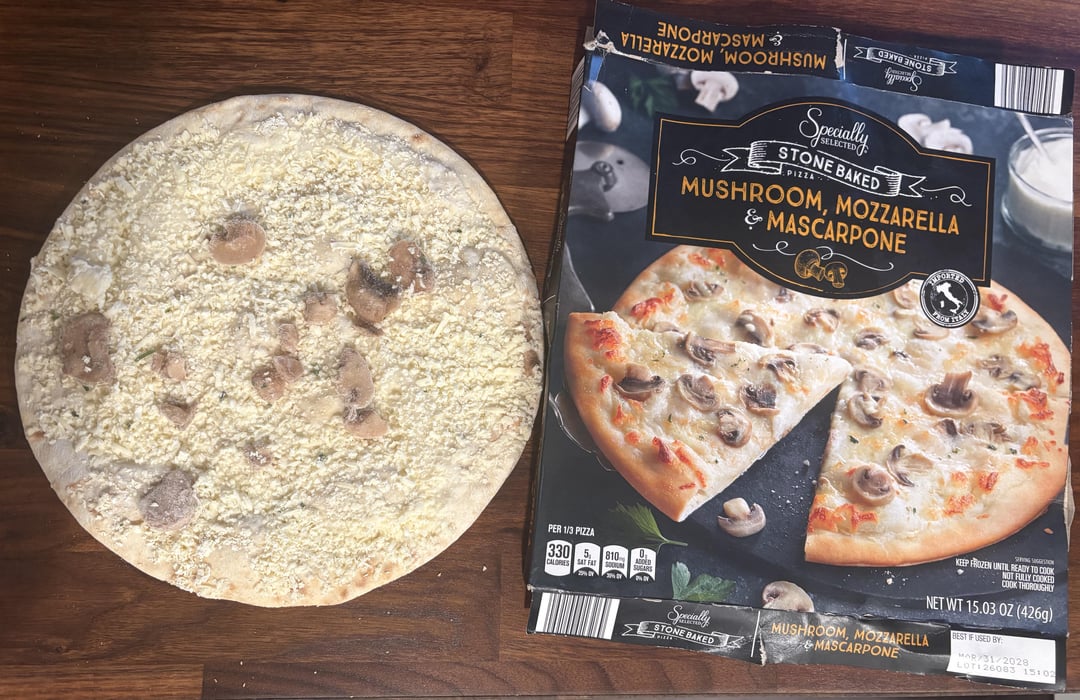 Specially hypad STONE BAKED PIZZA 2 MUSHROOM, MOZZARELLA & MASCARPONE PORTED PER 1/3 PIZZA 330 810 BAMA Specially STONE BAKED KEEP FROZEN UNTIL READY TO COOK NOT FULLY COOKED COOK THOROUGHLY NET WT 15.03 OZ (426g) MUSHROOM, MOZZARELLA &MASCARPONE BEST IF USED BY MAR/31/2028 LOTI 26083 15:02