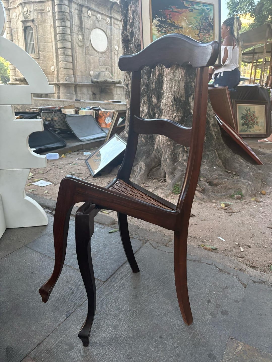 This chair has front legs carved to look like they are crossed