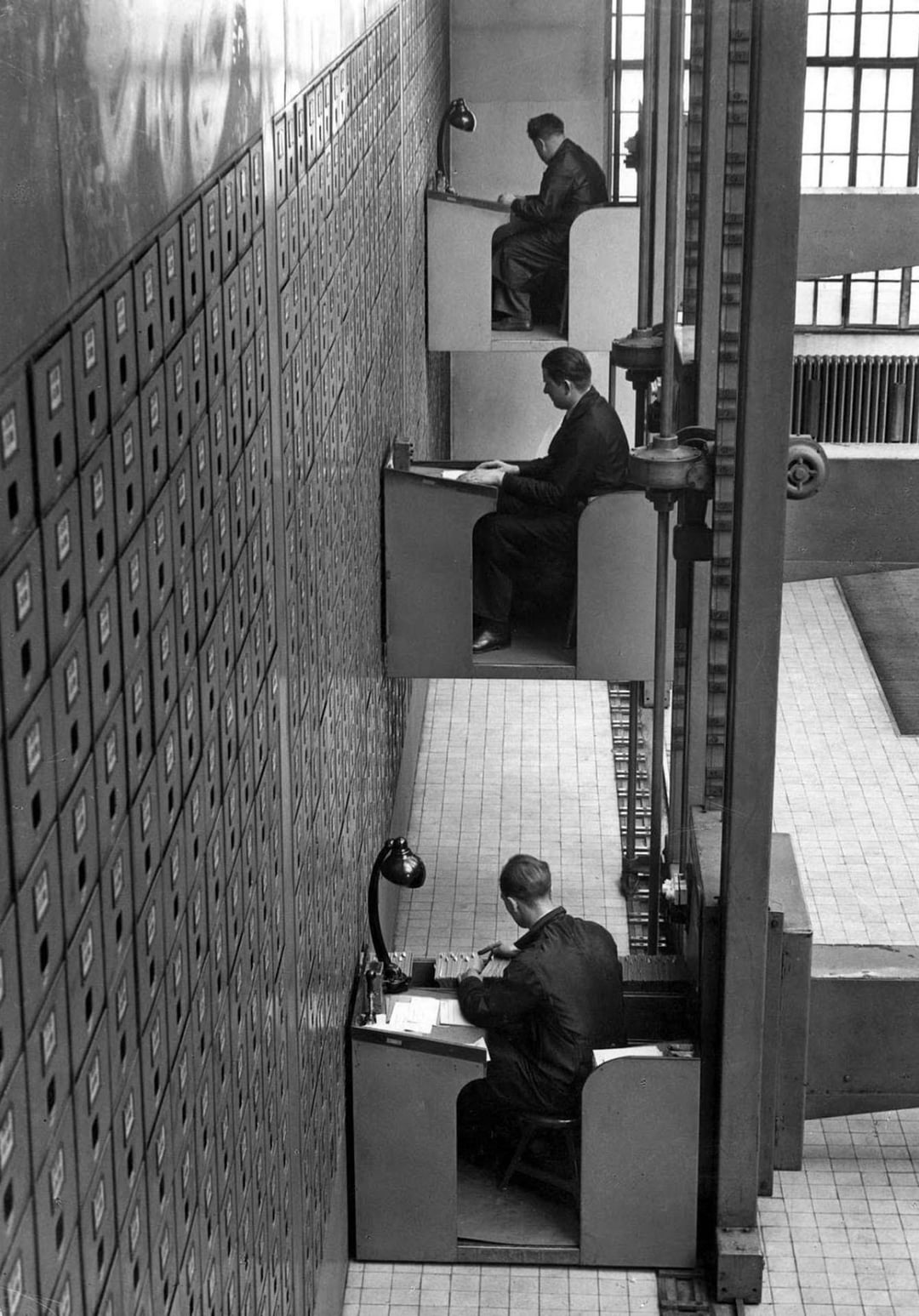 Motorized elevator desks in Prague, 1937